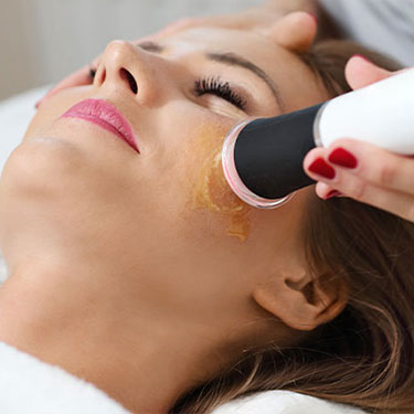 Patient receiving glo2facial for sun damage at Skinlastiq Medical Laser Cosmetic Spa in Burlingame